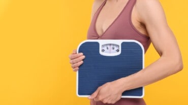 Woman with weight scale